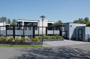 Breskens Chalet TIMEOUT Breskens mit Zaun Hausnr B26